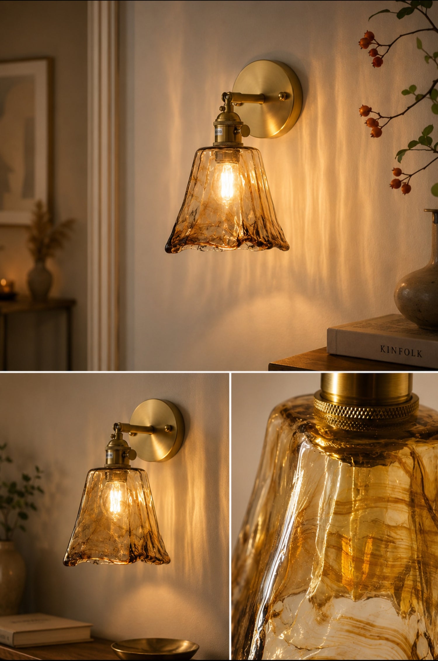 Amber textured glass wall sconce with brushed brass arm lit above bedroom nightstand